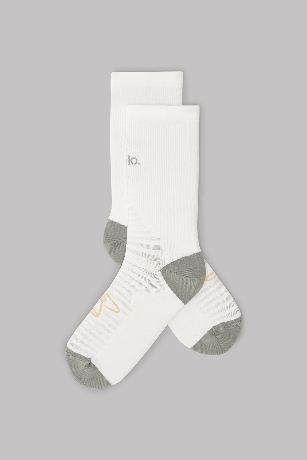 White socks with a logo on a gray background